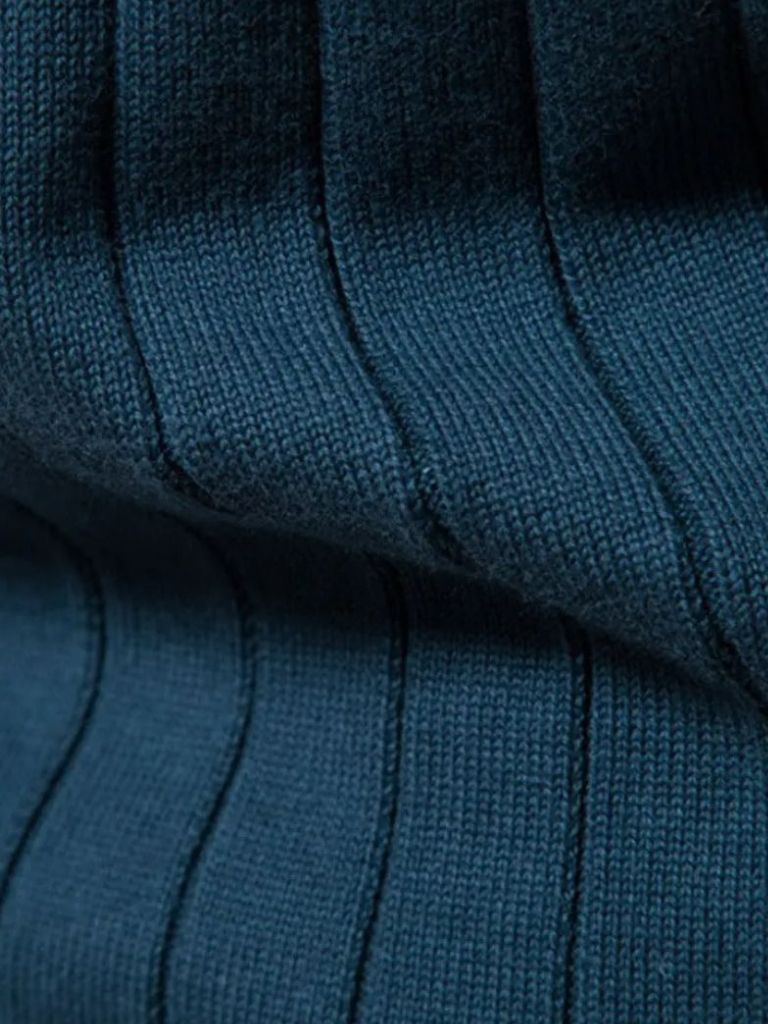 Suéter de cárdigan de punto con cremallera y jacquard en color sólido